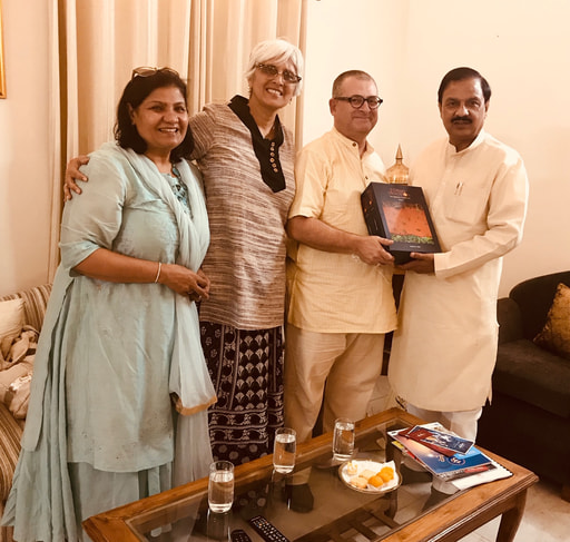 Mahaprabhu dasa giving Forms of Devotion book to Minister of Culture of India